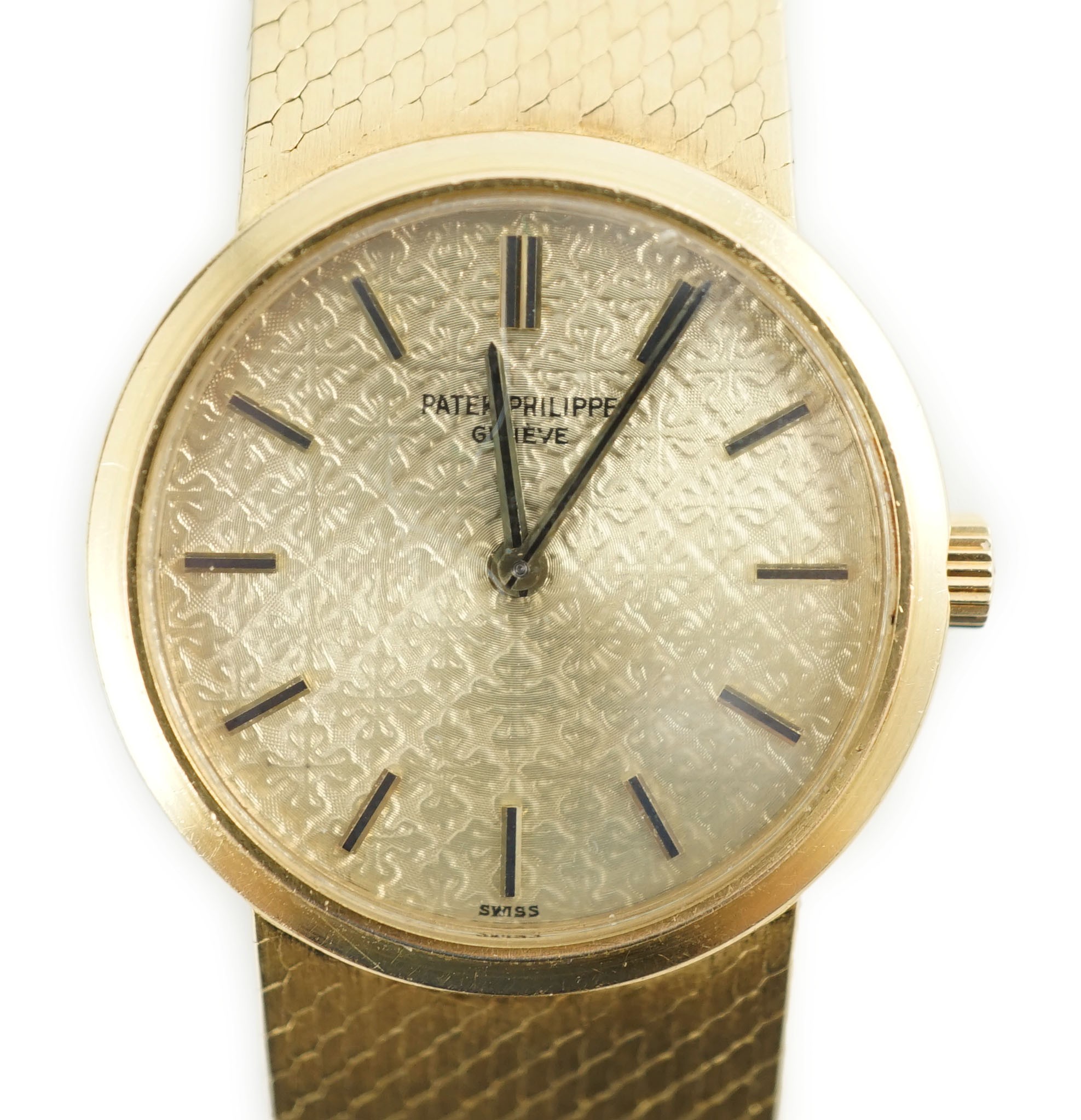 A lady's 18ct gold Patek Philippe manual wind wrist watch, on an integral 18ct gold Patek Philippe bracelet